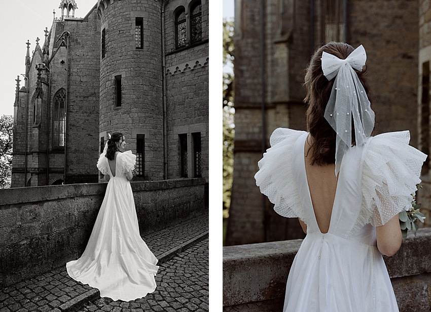 Links: Eine Person in einem langen, weißen Kleid steht neben der Steinfassade von Schloss Marienburg, deren Spitzbögen einen historischen Charme ausstrahlen. Rechts: Die Nahaufnahme des Kleides zeigt gerüschte Ärmel und eine große Schleife im Haar. Die Kulisse ist perfekt für ein Hochzeitsshooting mit gotischen Architekturelementen.